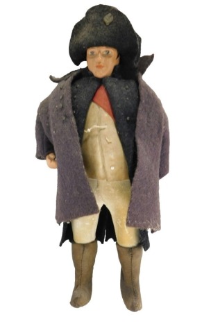 A 19thC and later costume doll of Napoleon, with felt clothing, kid covered body, etc., 22cm high.