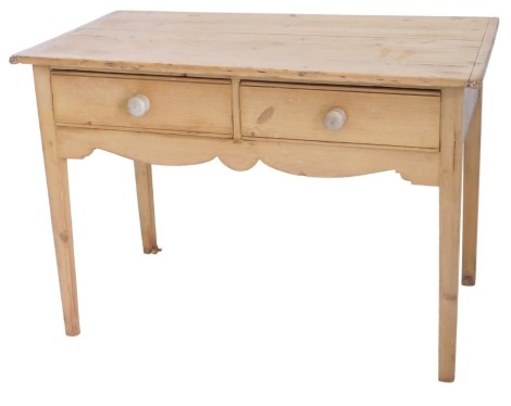 A Victorian pine dairy table, the rectangular planked top with cleted ends, above two frieze drawers and a shaped apron, on square tapering legs, 76cm high, 110cm wide, 61cm deep.