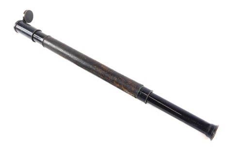 A three draw telescope, with leather middle section, with clip clasp, unmarked, 45cm long.