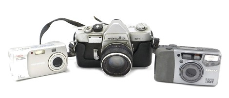 A Minolta SR1 camera (AF) and two other cameras.