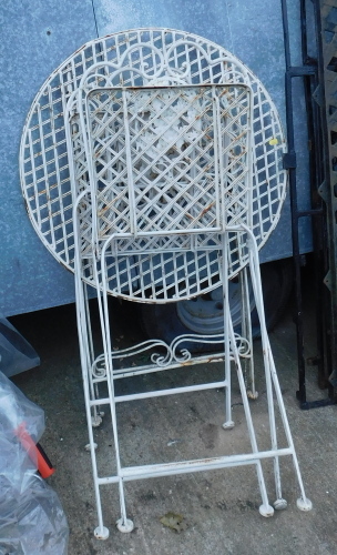 A cream painted folding metal garden table and two folding chairs. Buyer Note: VAT is payable on the hammer price of this lot