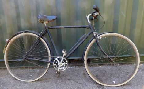 A vintage gentleman's bicycle, with pump.