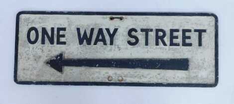 A painted cast metal one way street sign, 28.5cm x 76cm.