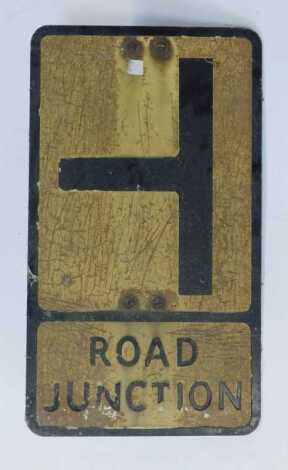 A painted enamel road sign for Road Junction, with two rounded supports to back, 53.5cm x 31cm.