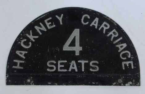 A Hackney Carriage four seats painted metal sign, 19cm x 31cm.