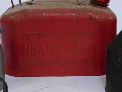 Two ready-can fuel cans, in red, together with various oil dispensers, enamel funnel, etc. - 4