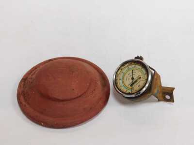 A Pulley 3100 speedometer, together with a painted red metal Ford hubcap and a green enamel jug. - 2