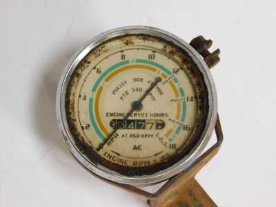 A Pulley 3100 speedometer, together with a painted red metal Ford hubcap and a green enamel jug. - 3