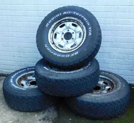 Four B F Goodrich radial all-terrain tyres, LT245/75 R16, on steel rims.