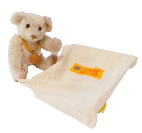 A Steiff The Millennium Teddy bear, in white mohair, 654701, 32cm, with certificate, in cloth bag.