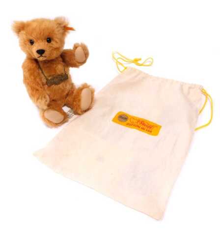 A Steiff Centenary bear, with growler, 1920-2002, blonde mohair, 30cm high, with certificate, in cloth bag.