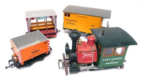 An LGB by Lehmann G scale Lake George and Boulder set, including an 0-4-0 locomotive Lake George and Boulder Rusty, 4105 Lake George and Boulder wagon, 4107 Lake George and Boulder Caboose. (4)