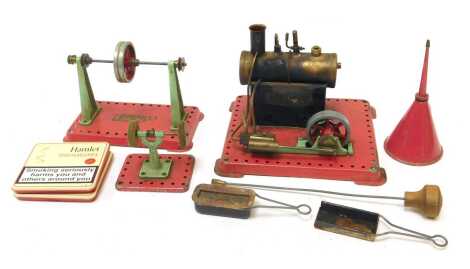 A Mamod stationary steam plant and accessories, including polishing wheel, line shaft and accessories. (1 tray)