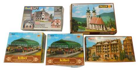 Five kit built HO scale buildings, comprising Vollmer Kurhaus, two Kibri HO stations, B-9522, a Revell Customs House, Revell Westphalian, and a Faller house, B-351, boxed.