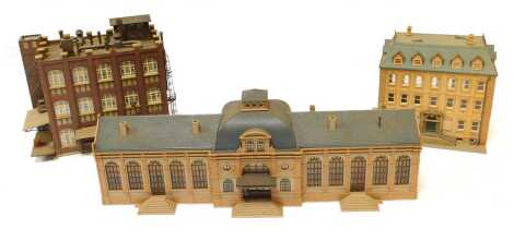 Three HO scale buildings, comprising a Vollmer Altstadt Station, Pola four-storey municipal building, and Kibri factory/warehouse.