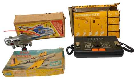 An Inter City Service plastic helicopter, boxed (AF), together with an Interstate video game, and a Selcol Products Ltd Ryan Trainer Strombecker model plane. (3)