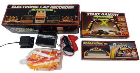 Various Scalextric accesories, including a Scalextric Dunlop bridge C700, Scalextric start gantry and Scalextric electronic lap recorder, each boxed, together with two unboxed hand throttles, a C922 power unit, C298 standard hand throttle, and various pla