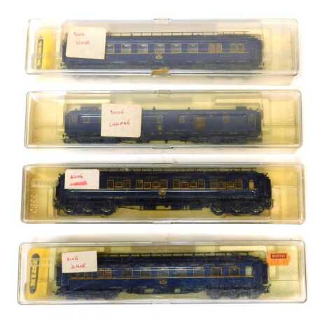 Trix HO gauge coaches, including Orient Express dining cars of The CIWL in blue, luggage van, Speisewagen, etc., boxed. (4)