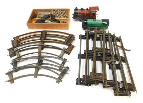 Hornby tinplate clockwork O gauge locomotives and track, and a small quantity of Britains sheep and farmyard fencing. (1 box)