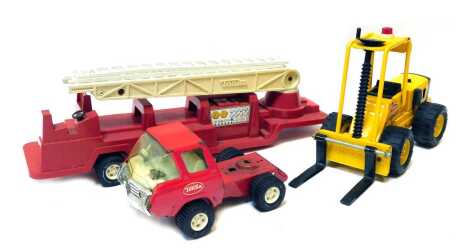 Tonka toys, including a Tonka forklift and a Tonka fire engine and tender.