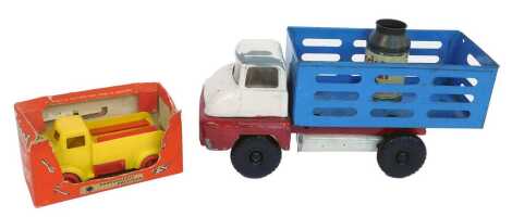 A Tri-ang Ford Thames Trader, Tri-ang dairy milk churn, and a Tri-ang boxed Fix It truck. (3)