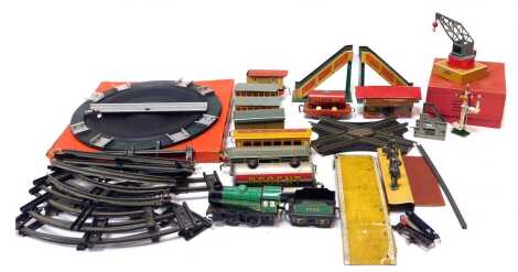 Hornby O gauge tinplate clockwork locomotive and rolling stock, including 0-4-0 clockwork locomotive, rolling stock, track, and accessories including platform and crossing. (2 trays)