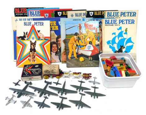 Toys and annuals, including Dinky Toys aeroplanes, Blue Peter annuals, Herald Swopetts, etc. (1 tray)