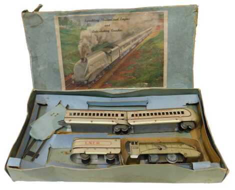 A Louis Marx & Co number 303 silver sparking passenger train set, boxed.