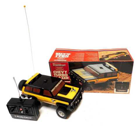 A Massey Ferguson Power Part radio controlled Chevvy Turbo Blazer, boxed.