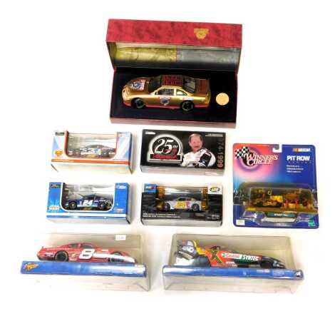 Action and other Nascar diecast, including Action Nascar Country 50th Anniversary 1948-1998 Bill France Senior, Action Winner's Circle number 8 Dale Earnhardt Junior, Chevrolet Monte Carlo, AC Delco Superman Racing Dale Earnhardt Junior Nascar, etc. (a qu