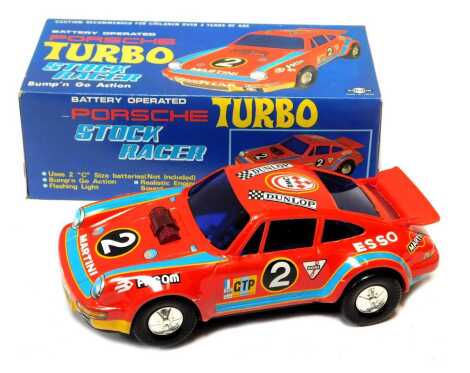 A Dashin battery operated number 7373 Porsche Turbo stock racer, bump and go, boxed.