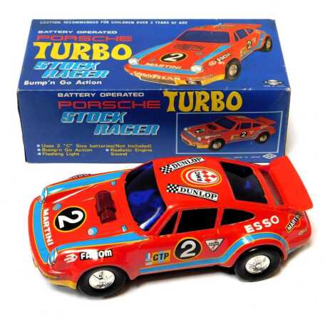 A Dashin battery operated Porsche Turbo Bump N Go stock racer, boxed.