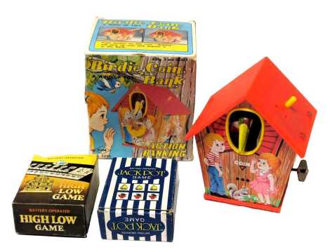 A Yone wind up Birdy coin bank, a battery operated High Low game, and a battery operated Jackpot game, boxed. (3)