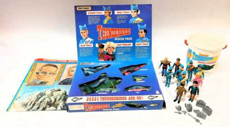 A Matchbox Thunderbirds Rescue Pack, Matchbox Thunderbird figures, comprising Alan, Virgil, Scott, John, Jeff, Brains, Lady Penelope, Parker and The Hood, and a Daily Mirror Thunderbirds poster. (a quantity)