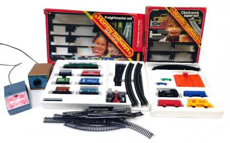 Hornby Railways OO gauge R533 clockwork Super set, Hornby Railways OO gauge R682 Freight Master set, and OO gauge track and a Mini Models Limited Smooth Flow transformer. (a quantity)