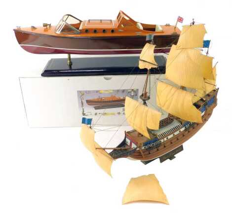 A Leonardo model speed boat, boxed, together with a model two masted ship, 43cm high.