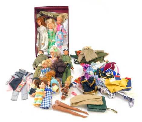 A group of dolls, to include Sindy, Barbie, etc., together with various clothing. (2 boxes)