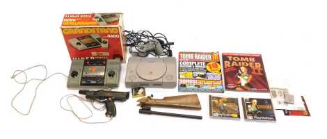 A Sony PlayStation, model number SCPH-5552, together with a Grand Stand Video Sports Centre, model 4600, PlayStation games to include Tomb Raider, etc. (1 box)