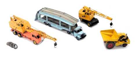 Dinky Toys diecast, playworn, comprising a Dinky mobile crane, car transporter, a Muir-Hill dumper, and a twenty tonne lorry mounted crane.