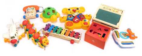 Various toys, to include a Fisher Price dial telephone, Xylophone, building blocks, a Bring Along a Song, a Shapey turtle, etc.