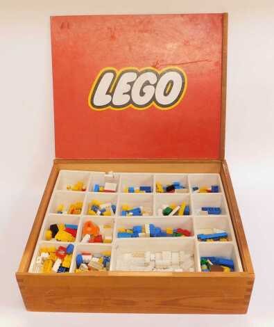 Lego, contained in a box with plastic interior with various recesses, 48cm wide.