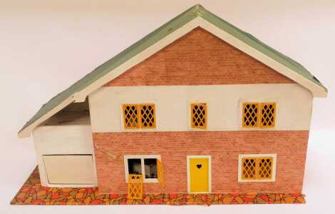 A mid century two storey doll's house, 52cm high, together with various wooden houses, etc.