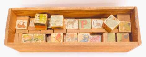 Wooden building blocks, each with partial transfer printed decoration.