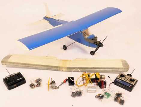 A remote controlled biplane, in blue, with engine, etc.