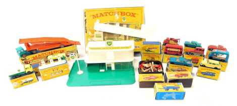 A Matchbox Service Station, MGI, boxed, together with various Matchbox cars, including trailer with removable sports boat, Lincoln Continental, Snow Trac, Routemaster, etc. (a quantity)