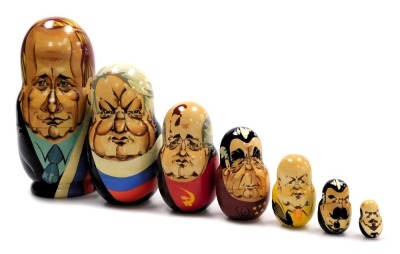 A graduated set of seven USSR matryoshka dolls, depicting the leaders of the Soviet Union, comprising Lenin, Stalin, Khrushchev, Brezhnev, Gorbachev, first president of Russia Boris Yeltsin and Vladimir Putin.