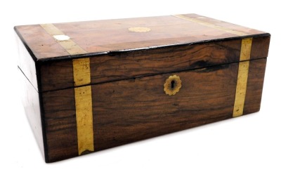 A Victorian walnut and brass bound writing slope, the hinged lid opening to reveal a fitted interior, 40cm wide, 24cm deep.