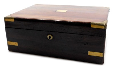 A Victorian rosewood and brass bound writing slope, opening to reveal a fitted interior, 30cm wide, 23cm deep.