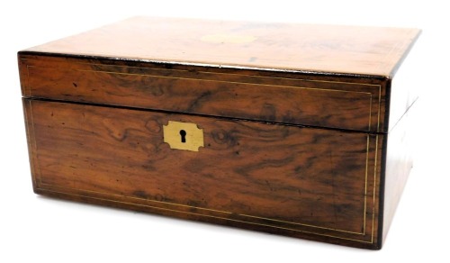 A Victorian walnut writing slope, with ebony banding and brass line inlay, and escutcheons, opening to reveal a fitted interior, 35cm wide, 22.5cm deep.