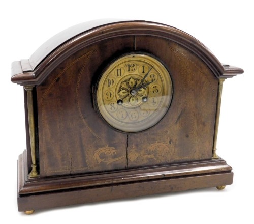 A Victorian mahogany and inlaid mantel clock, circular brass dial, with chapter ring bearing Arabic numerals, Japy Freres & Cie, with coil strike, the case of domed form, raised on brass columns, above a rectangular base, on brass ball feet, no key, 26.5c